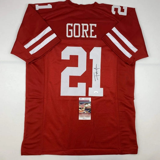 Autographed red custom jersey from a professional sports league collectible