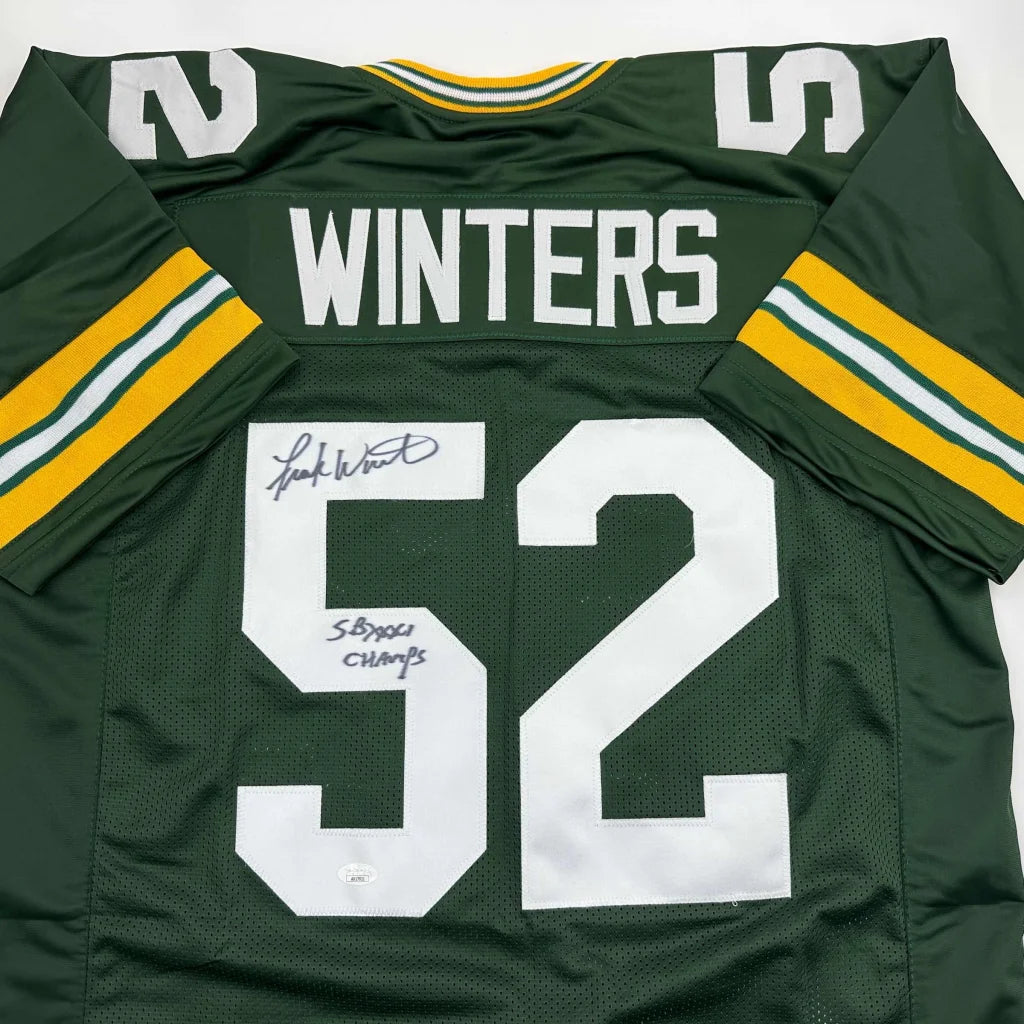 Back of an autographed green and yellow green bay packers custom jersey with white winters 52 lettering from professional sports league