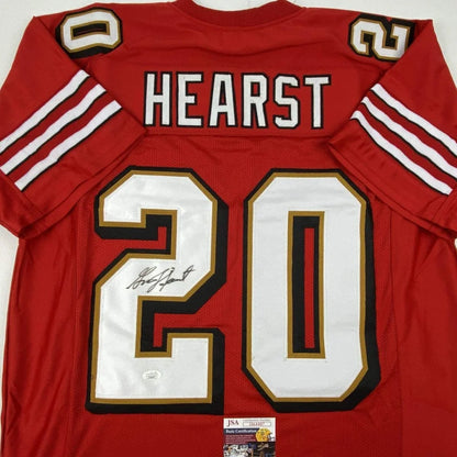 Autographed red football jersey with white and gold number 20, perfect for sports league fans