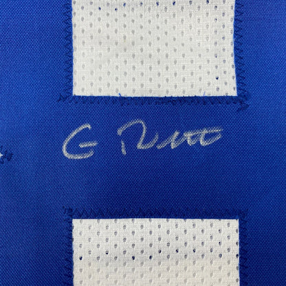 Blue and white mesh custom jersey with stitched signature from professional sports league displayed for collectors