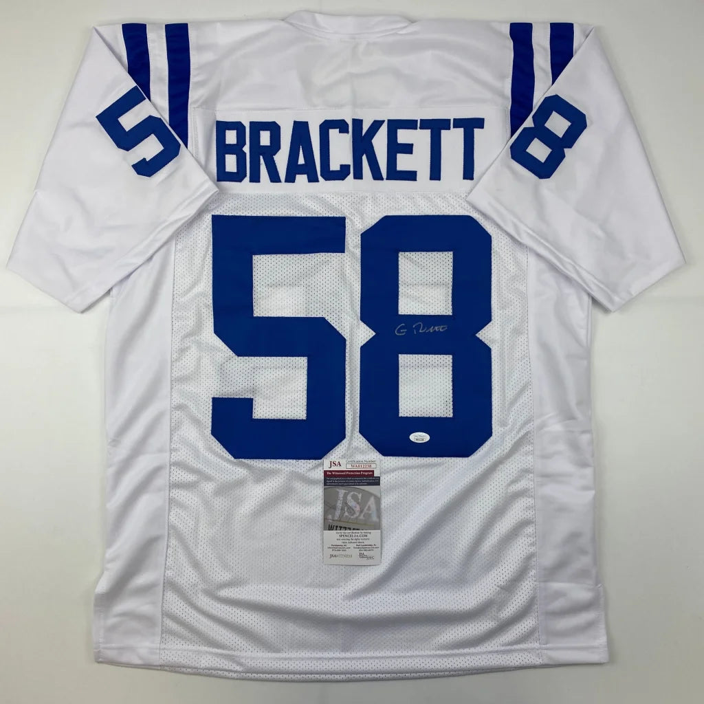 Back of a white indianscolts custom jersey with blue number 58 brackett name and signed by gary brackett professional sports league