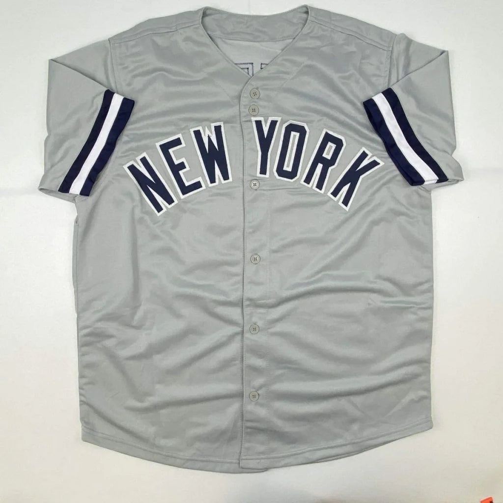 Gray New York Yankees custom jersey with navy and white striped sleeves from professional sports league
