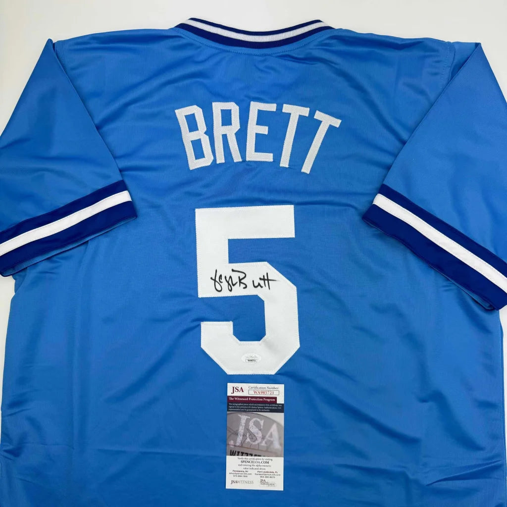 Autographed light blue George Brett Kansas baseball jersey with white trim, custom jersey