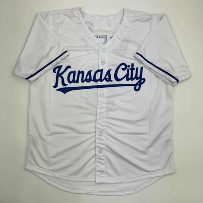 Autographed George Brett custom Kansas City white baseball jersey with navy blue cursive lettering, JSA COA