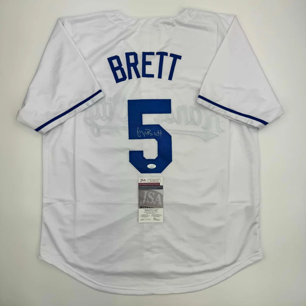 Autographed George Brett custom jersey with white design, blue Brett name above number 5, JSA COA