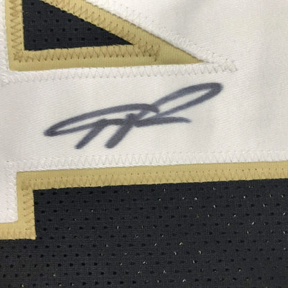 Autographed black and white custom jersey with gold trim from Giannis Antetokounmpo in professional sports