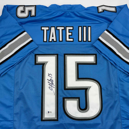 Back of custom blue Detroit Lions football jersey with white silver lettering Tate III 15 autographed professional sports league