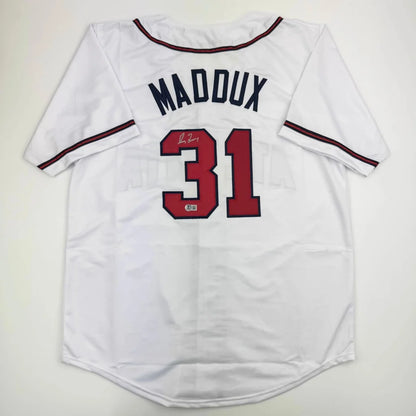White custom jersey with red and navy trim from Maddux 31 sports league collectible