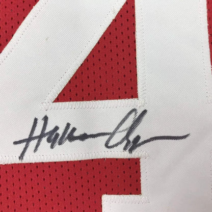 Autographed Hakeem Olajuwon red custom jersey with number 4, professional sports