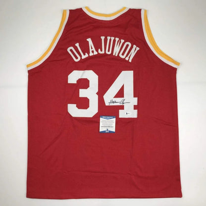 Red basketball jersey with yellow trim and white numbers from Hakeem Olajuwon custom jersey collection