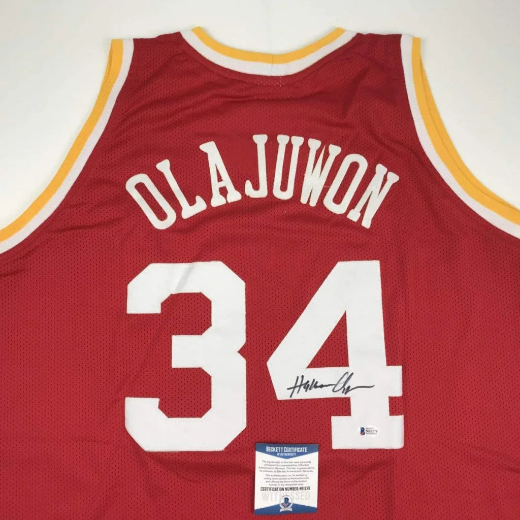 Autographed Hakeem Olajuwon red custom jersey with Olajuwon 34, Beckett COA