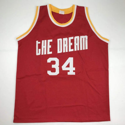 Autographed Hakeem Olajuwon custom jersey in red mesh with The Dream and number 34