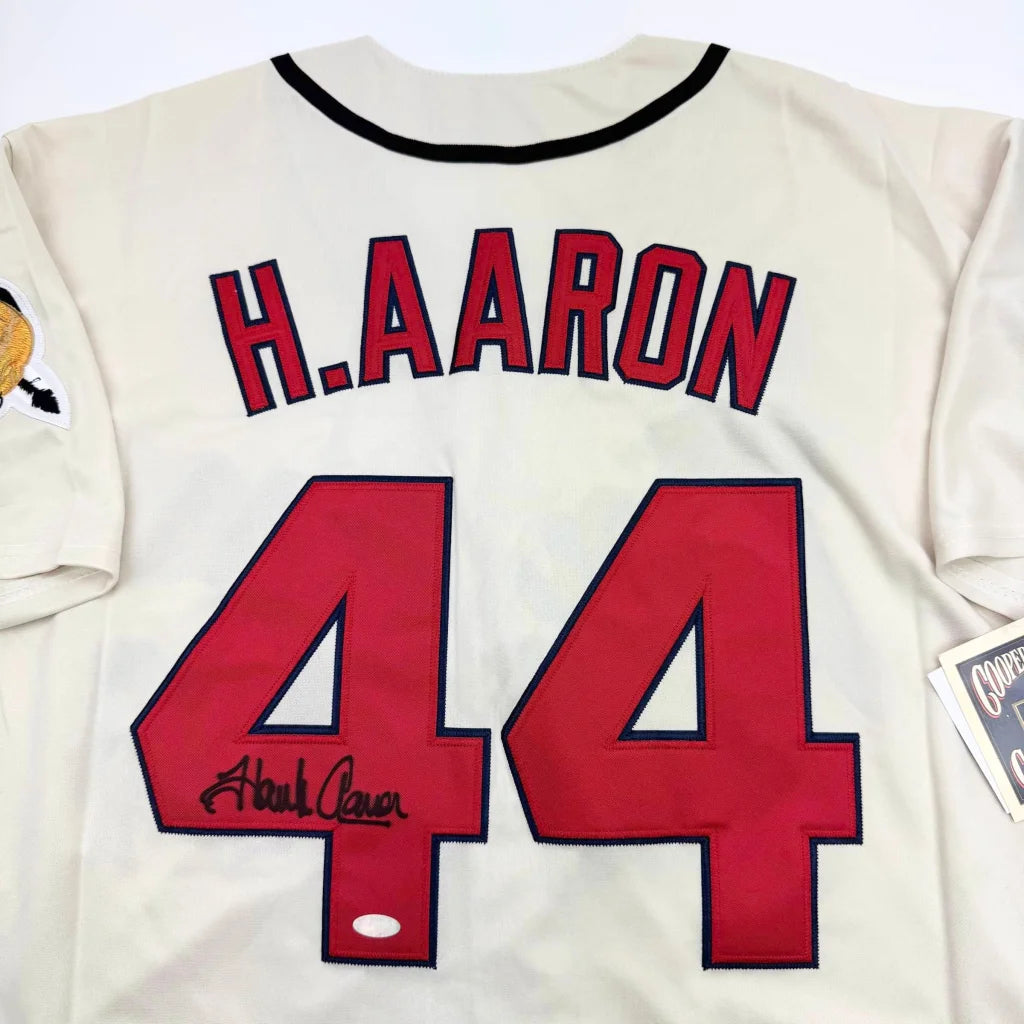 Autographed Hank Aaron #44 baseball jersey in a professional sports league custom jersey display