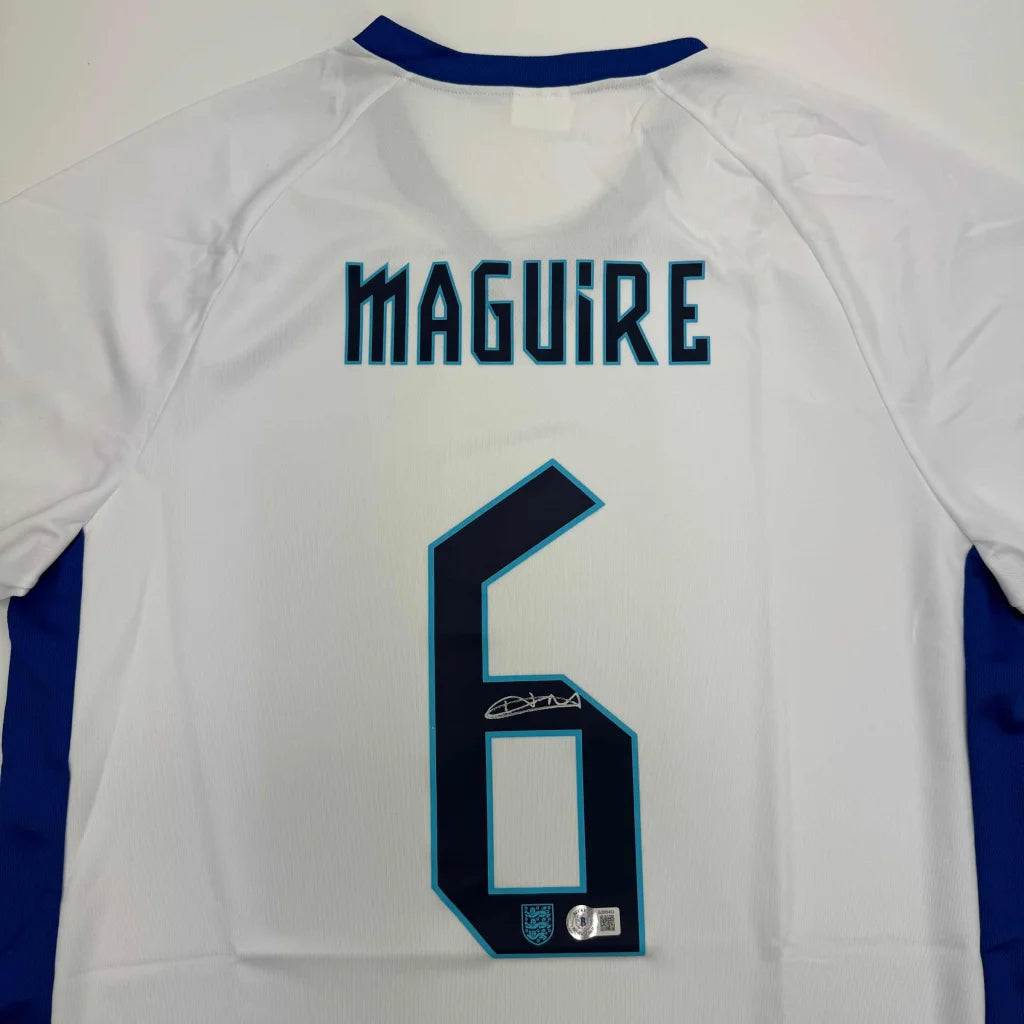 Autographed Harry Maguire England White Soccer Jersey Beckett BAS COA | Certified Authentic Signed Memorabilia | vintageantiquesgifts.com