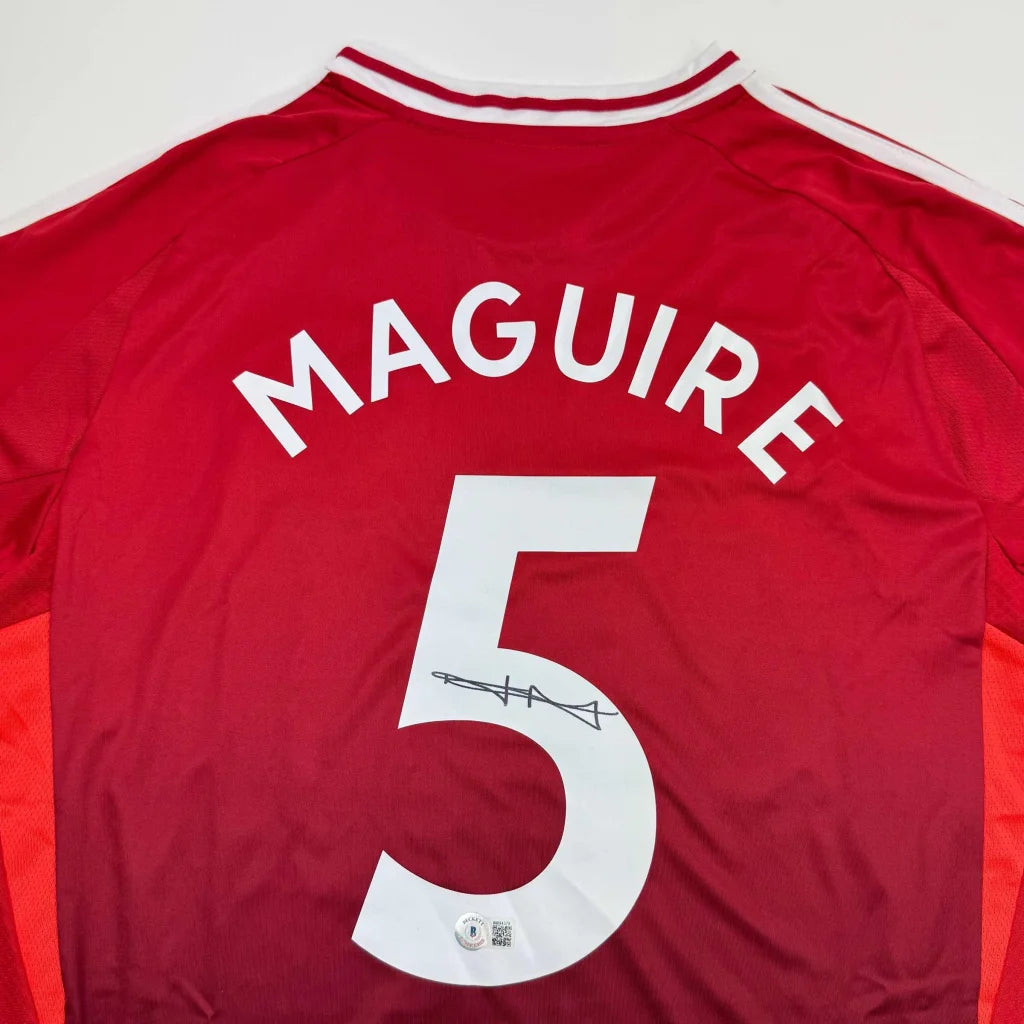 Autographed Harry Maguire Manchester United Red Soccer Jersey Beckett BAS COA | Certified Authentic Signed Memorabilia | vintageantiquesgifts.com