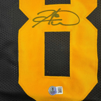 Autographed black and gold Football Jersey with number 8 from WARD 86