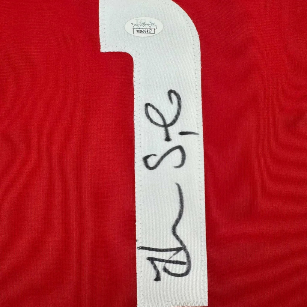 Red fabric with white stitched 1 and autograph on authentic SOLO custom jersey from professional sports league