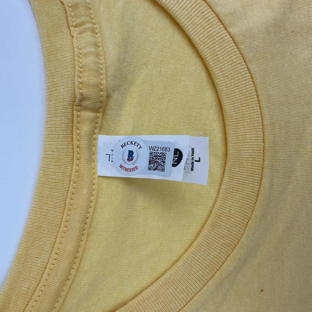 Autographed Hulk Hogan Hulkamania yellow WWE t-shirt with Beckett logo tag