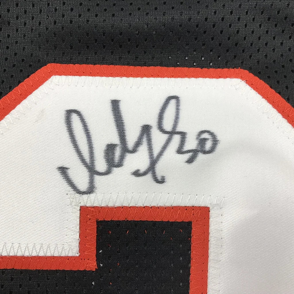 Autographed black custom jersey with orange and white trim from Woods 30 for professional sports league fans