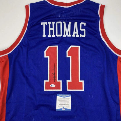Signed blue and red professional sports league custom jersey with THOMAS 11