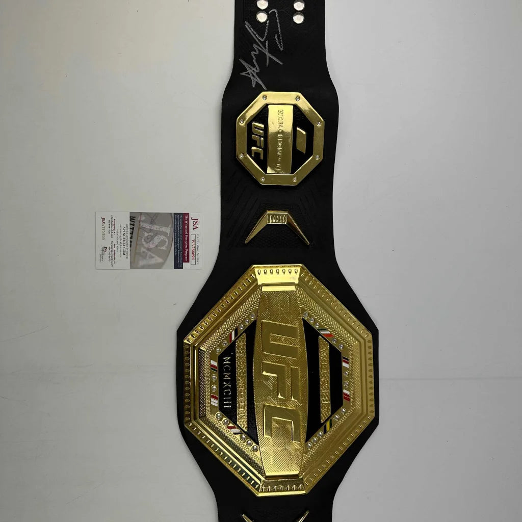 Autographed Israel Adesanya black replica UFC championship belt with gold octagon plates