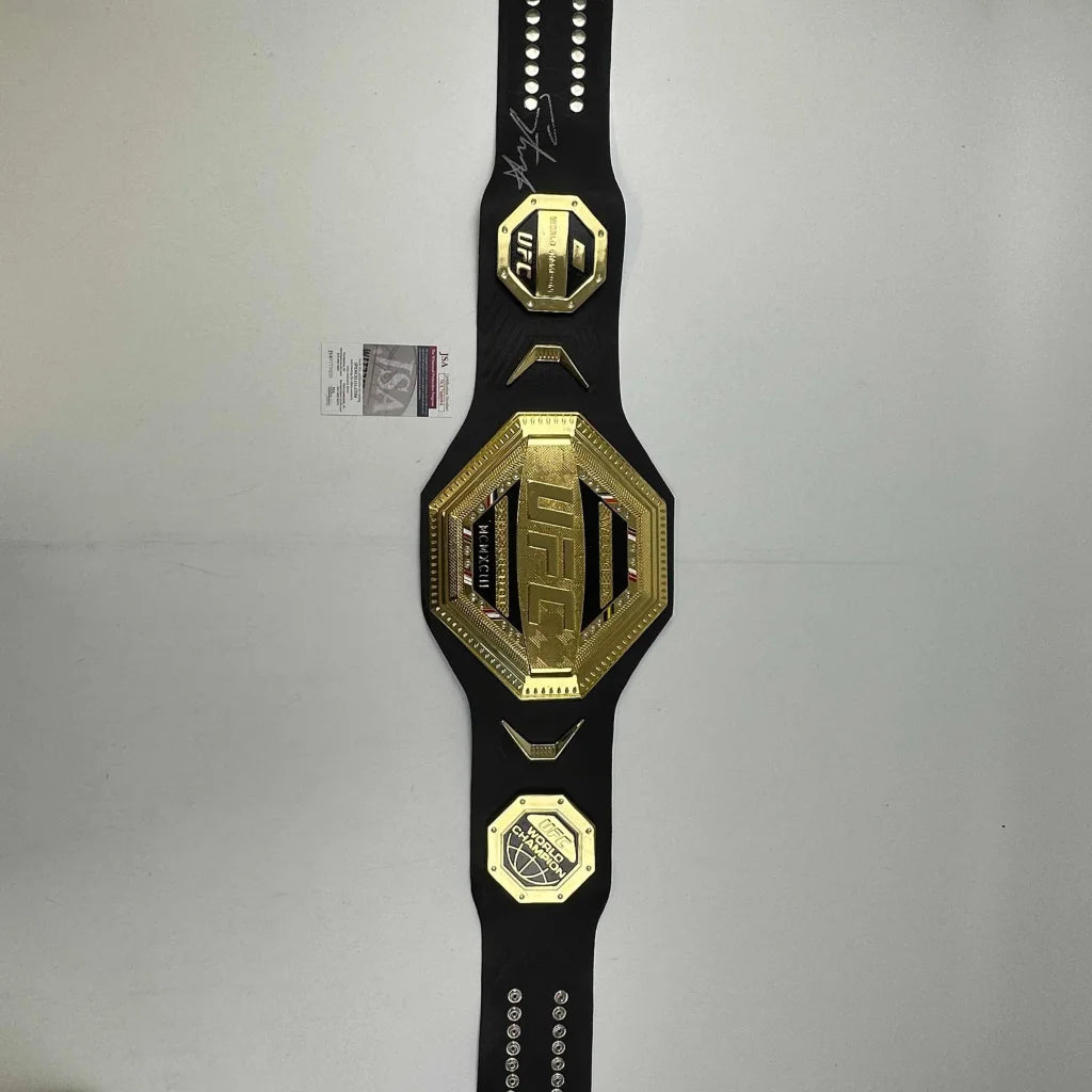 Autographed Israel Adesanya black UFC replica championship belt with JSA COA