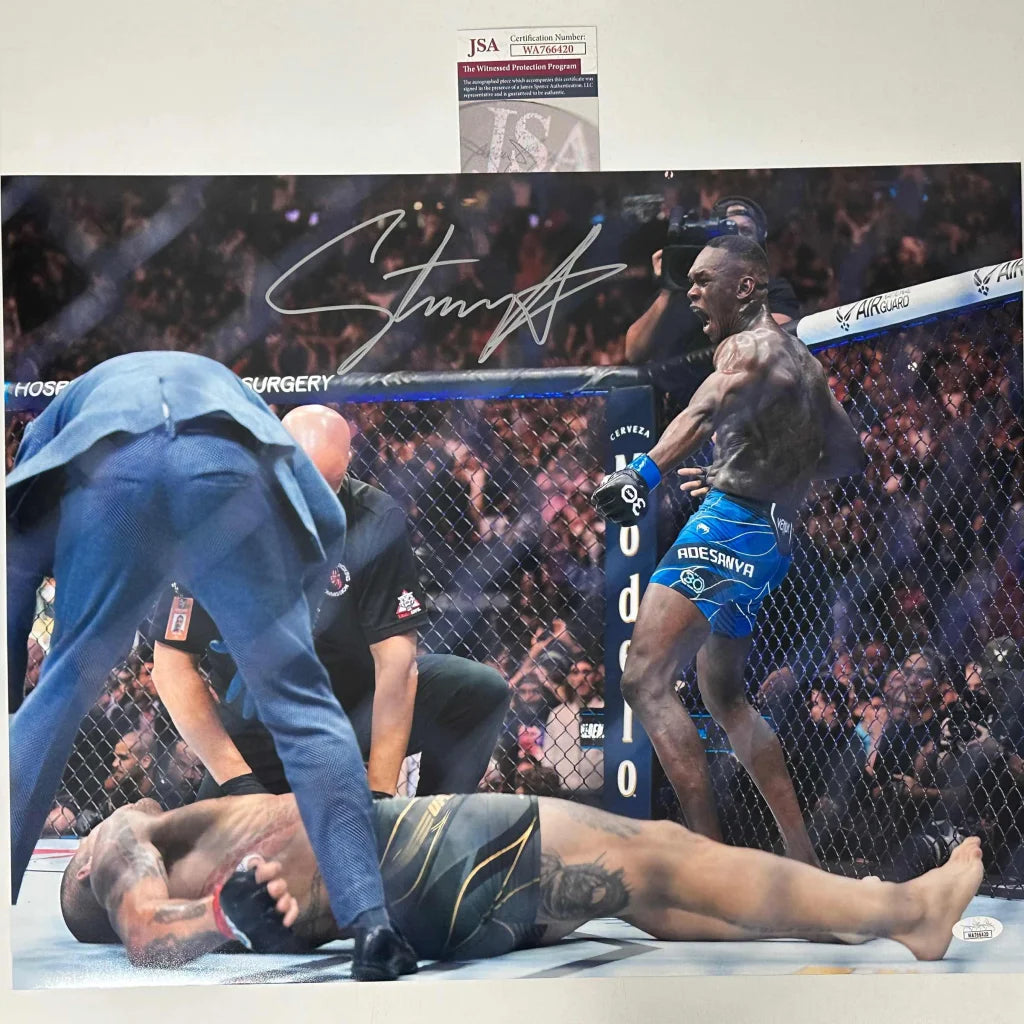 Signed Francis Ngannou UFC photo in blue shorts over opponent, JSA COA