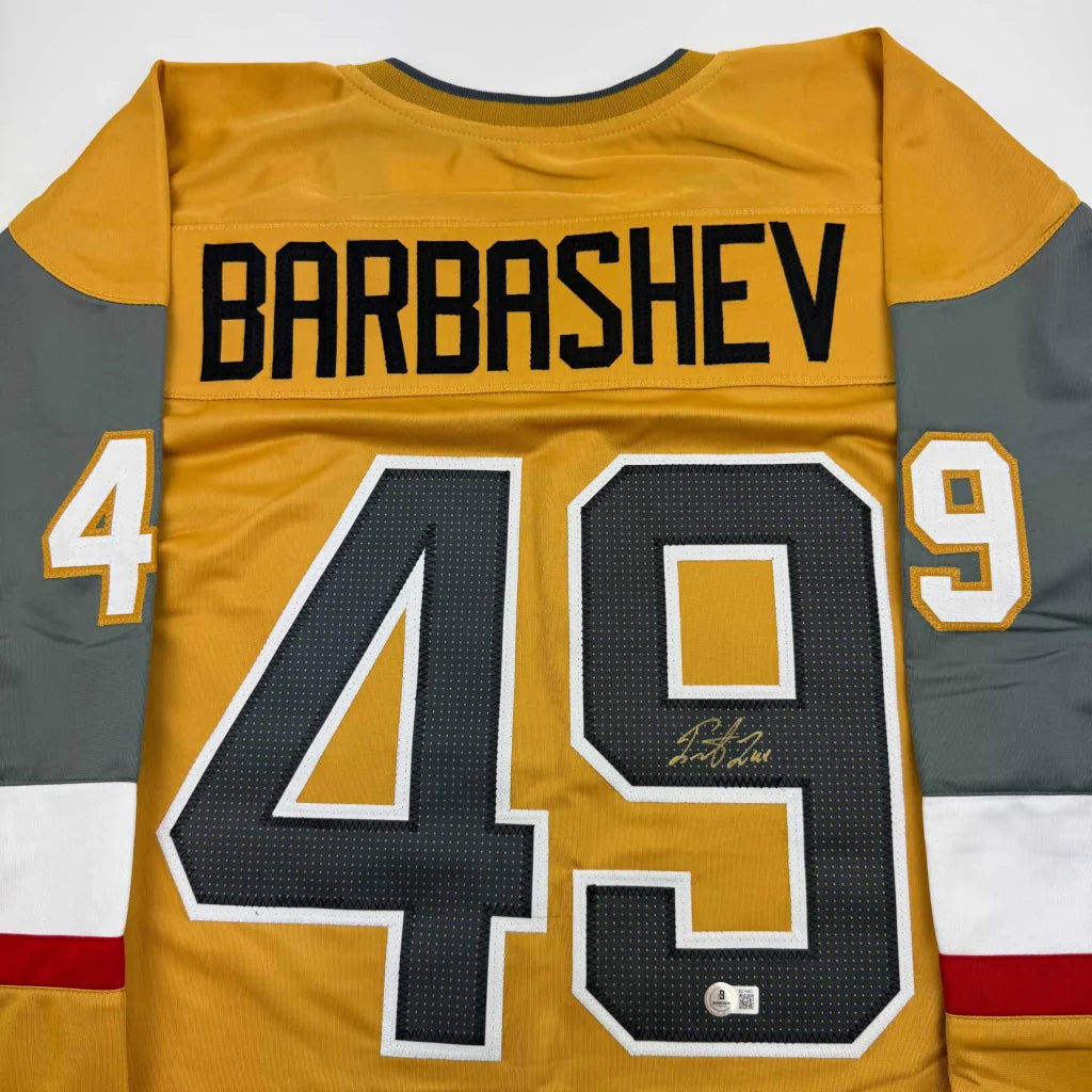 Gold and gray custom hockey jersey with number 49 and signature from professional sports league