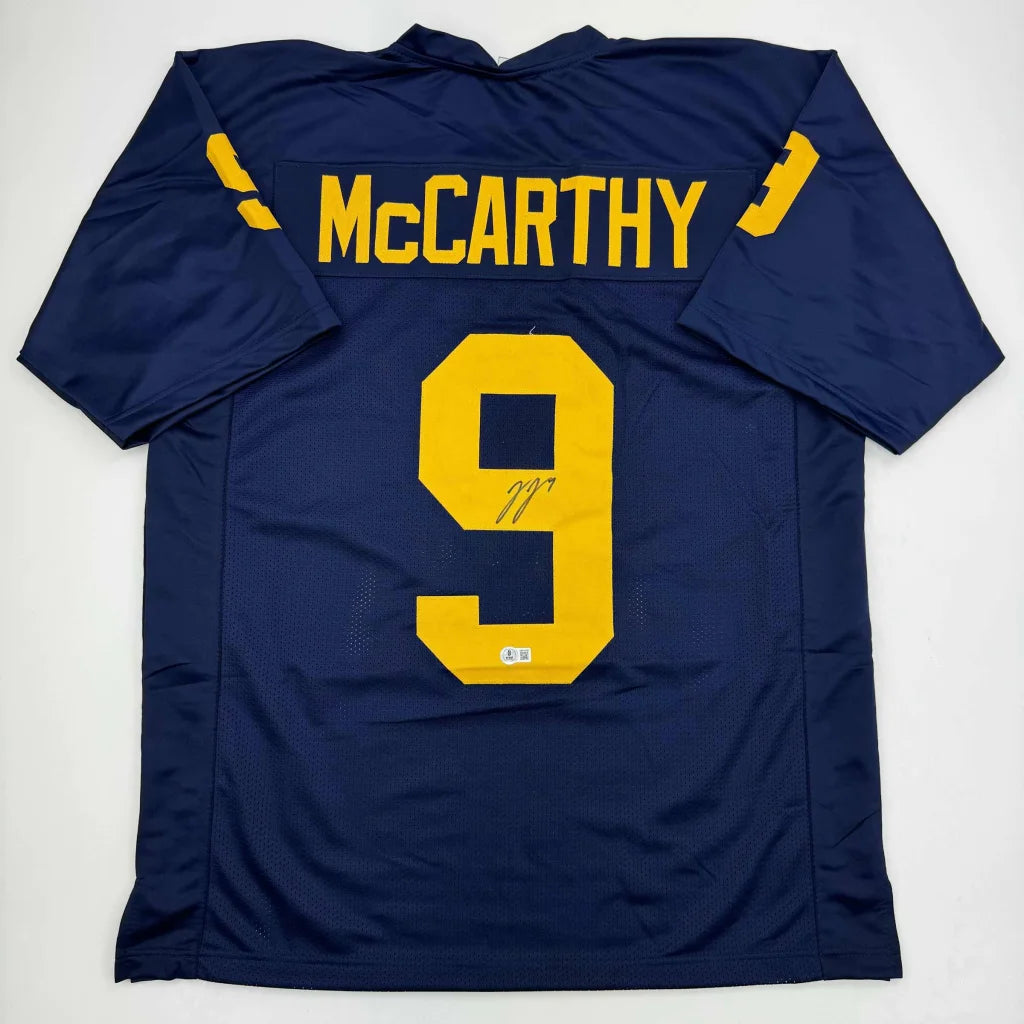Autographed dark blue custom jersey with yellow number 9 and McCarthy name for sports league