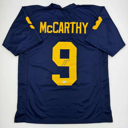 Autographed dark blue custom jersey with yellow number 9 and McCarthy name for sports league