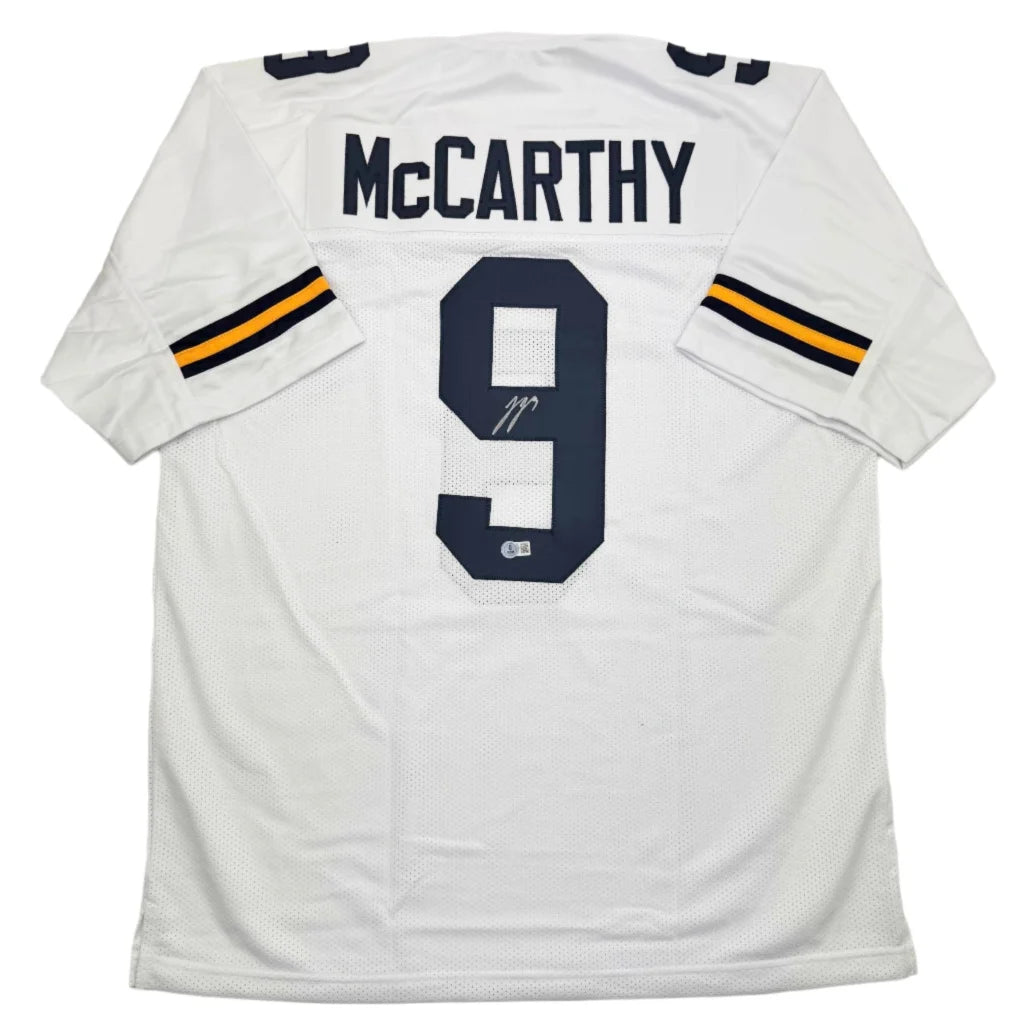 Back of autographed J.J. McCarthy custom Michigan white football jersey number 9