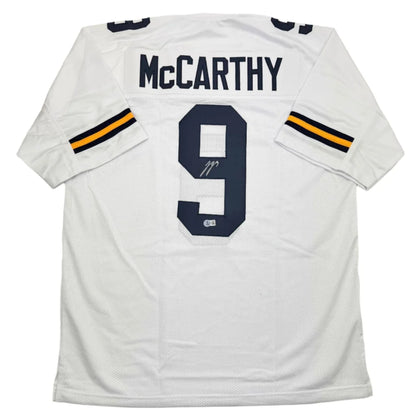 Back of autographed J.J. McCarthy custom Michigan white football jersey number 9