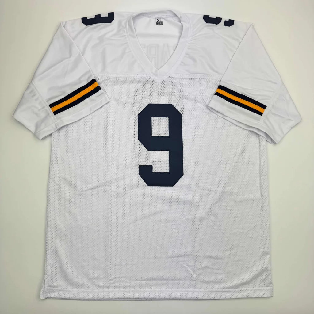 Autographed J.J. McCarthy white custom jersey with navy 9, Michigan college football
