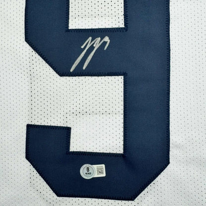 Autographed J.J. McCarthy navy blue number nine custom jersey patch Beckett COA