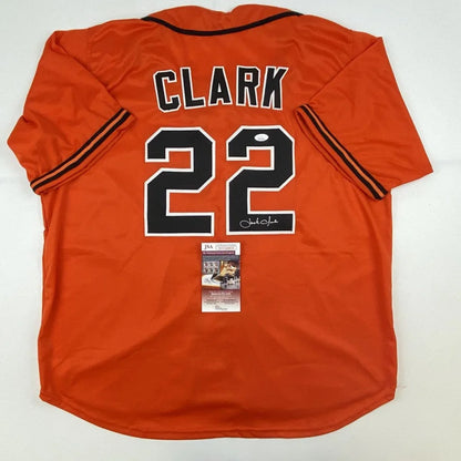 Orange custom jersey with black and white lettering and signature for professional sports fans