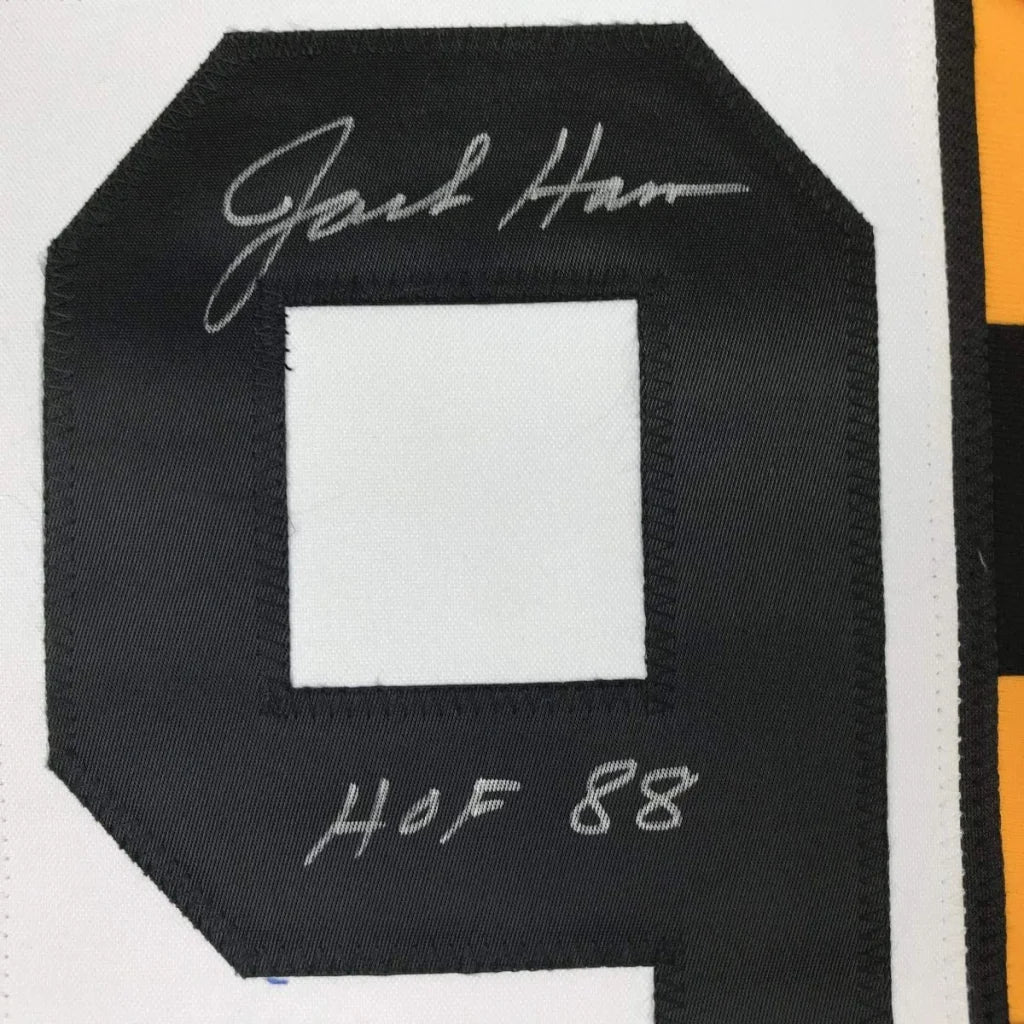 Black embroidered patch with white center featuring jack harman hof 88 silver thread on custom professional sports jersey