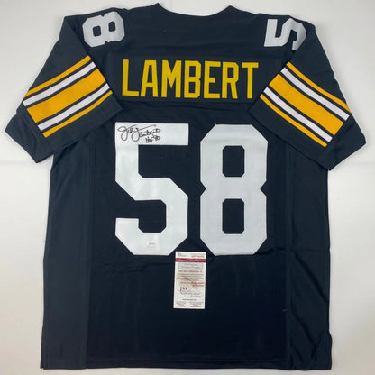 Back of a black autographed custom jersey with yellow and white lettering featuring lambert 58 from a professional sports league