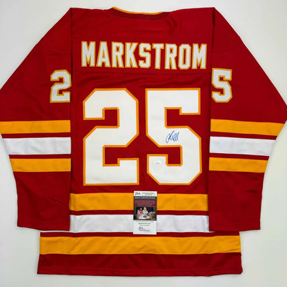 Autographed red custom jersey with MARKSTROM 25 for professional sports league fans
