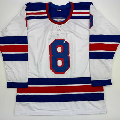 White hockey jersey with blue red stripes and number 8 from Trouba Custom Jersey for professional sports league