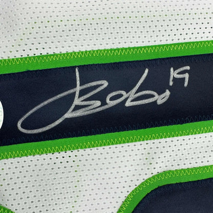 Autographed BOBO 19 custom jersey with green and navy accents from a professional sports league