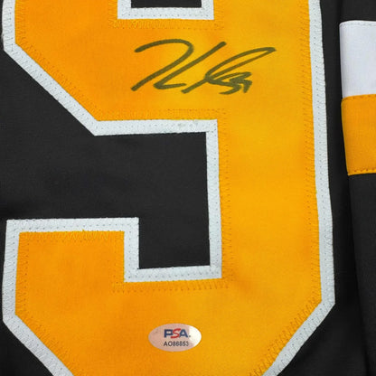 Black and gold custom jersey with signed number 3 from a professional sports league