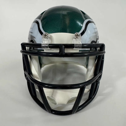 Green and white football helmet with black face mask, authentic third party authentication