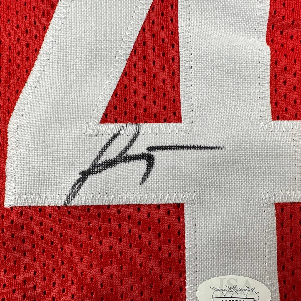 Red custom jersey with white 4 and black autograph from professional sports league