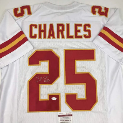 Back of a white kansas city chiefs custom jersey with red and gold lettering featuring charles 25 autograph for professional sports league fans