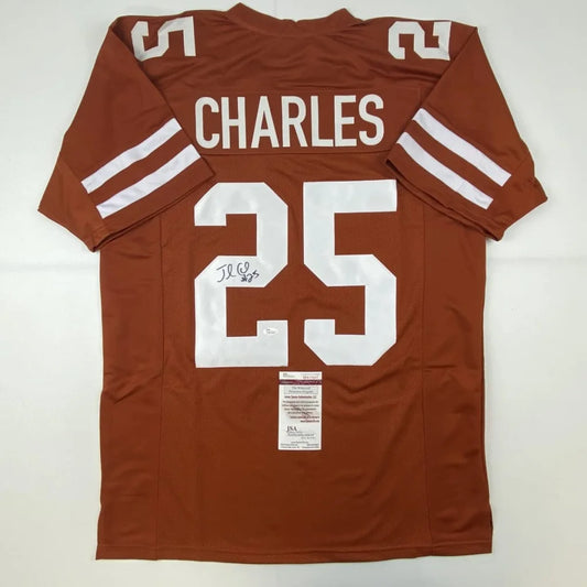 Back of a maroon texas longhorns custom jersey with white lettering autographed by jamaal charles number 25 professional sports league