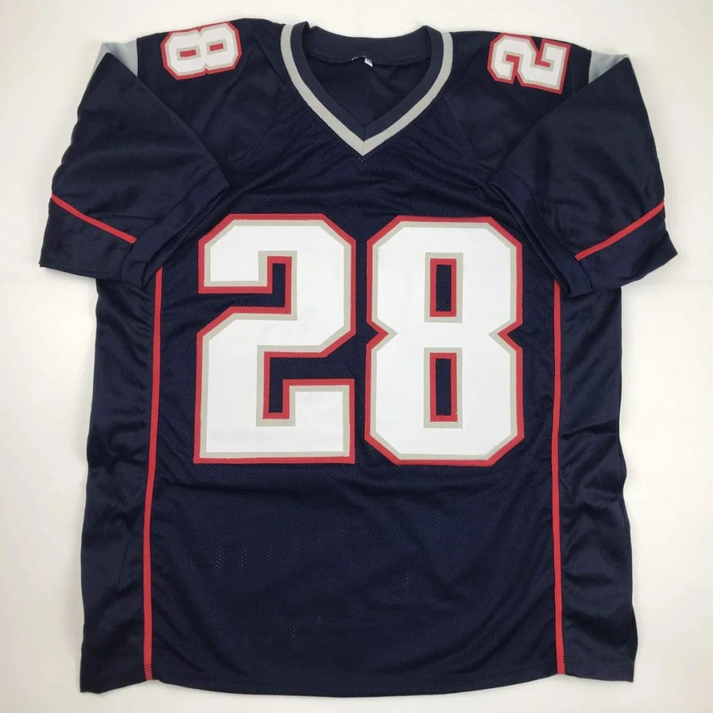 Navy blue custom jersey with white and red numerals autographed by James White from professional sports league football