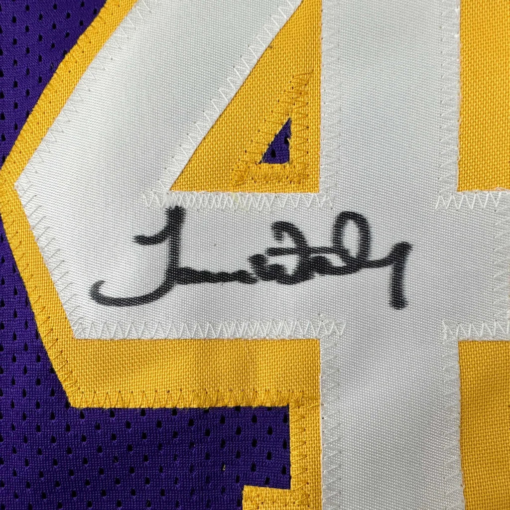 Autographed purple, white, and gold custom jersey from professional sports league with number 44