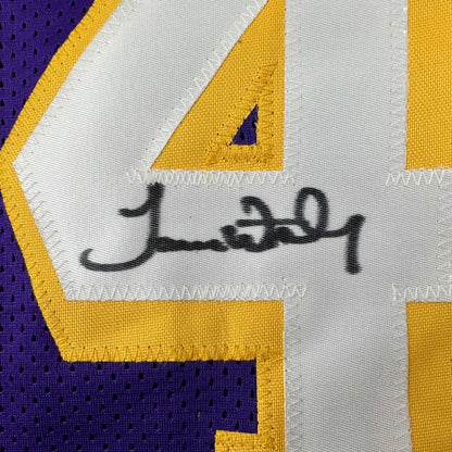 Autographed purple, white, and gold custom jersey from professional sports league with number 44