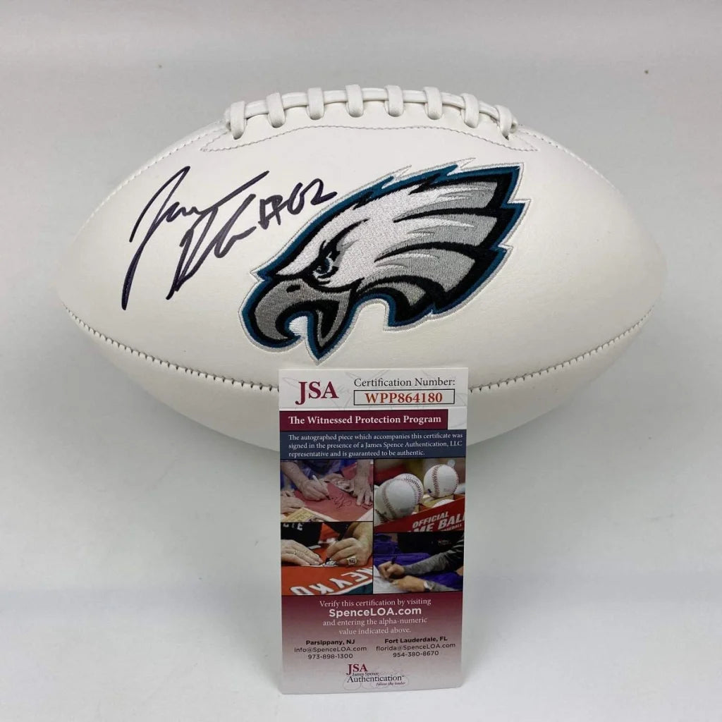 Autographed white full size football with silver and teal Philadelphia Eagles logo and black Jason Kelce signature