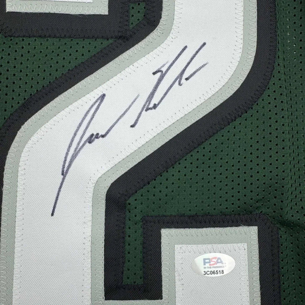 Green and white mesh custom jersey with black trim and signature on sleeve from professional sports league